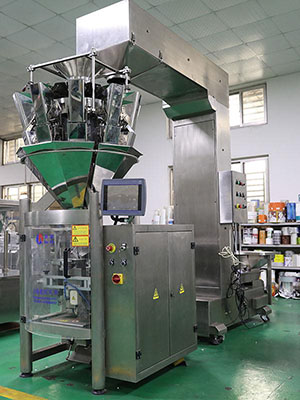 Máquina llenadora y selladora de productos granulados vertical
